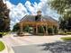 Charming entrance gate with stone accents surrounded by manicured landscaping at 10257 Henbury St, Orlando, FL 32832