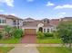Charming single-story home boasting a tile roof, two-car garage, and beautifully landscaped yard at 10257 Henbury St, Orlando, FL 32832