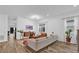 Bright living room with contemporary decor, wood-look floors, and a view to the outdoors, creating a welcoming space at 10257 Henbury St, Orlando, FL 32832