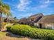 Inviting home exterior surrounded by vibrant green landscaping, offering curb appeal at 1174 Villa Ln # 115, Apopka, FL 32712