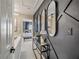 Stylish hallway with sophisticated decor, dark accent wall, and a glimpse into the bedroom at 1174 Villa Ln # 115, Apopka, FL 32712