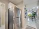 Modern kitchen featuring stainless steel refrigerator and a stylish decor at 1174 Villa Ln # 115, Apopka, FL 32712