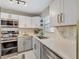 Modern kitchen featuring sleek, stainless steel appliances, countertops, and stylish cabinetry at 1174 Villa Ln # 115, Apopka, FL 32712