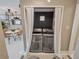 Convenient laundry closet with modern appliances and neutral design adjacent to dining room at 1174 Villa Ln # 115, Apopka, FL 32712