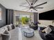 Cozy living room features comfortable seating, outdoor patio access, and a ceiling fan at 1174 Villa Ln # 115, Apopka, FL 32712
