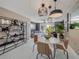 Open-concept living space flowing into the dining area with an outdoor patio view at 1174 Villa Ln # 115, Apopka, FL 32712