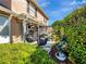 Relaxing patio featuring hanging egg chairs and lush greenery, perfect for outdoor enjoyment at 1174 Villa Ln # 115, Apopka, FL 32712