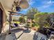 Inviting outdoor porch featuring multiple seating options, potted plants, and a lovely garden view at 1174 Villa Ln # 115, Apopka, FL 32712