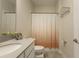 Bathroom features a vanity sink and patterned shower curtain at 11810 Imaginary Way, Orlando, FL 32832