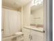 Clean bathroom with single sink vanity, mirror, toilet and shower-tub combo at 11810 Imaginary Way, Orlando, FL 32832