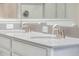 Elegant bathroom with dual sinks, granite countertops, and modern fixtures at 11810 Imaginary Way, Orlando, FL 32832