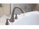Modern bathtub featuring stylish fixtures and a sleek design, perfect for relaxation at 11810 Imaginary Way, Orlando, FL 32832
