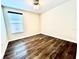 Bedroom with hardwood floors and a sunny window at 11810 Imaginary Way, Orlando, FL 32832
