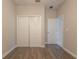 Bedroom features double closet doors, ceiling fan, and ensuite at 11810 Imaginary Way, Orlando, FL 32832