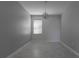 Unfurnished bedroom offers tiled floors, a ceiling fan, and neutral walls at 11810 Imaginary Way, Orlando, FL 32832
