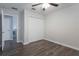 Neutral bedroom with laminate flooring, ceiling fan, and double door closet at 11810 Imaginary Way, Orlando, FL 32832