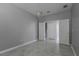 Unfurnished bedroom boasts neutral walls and adjacent stairs at 11810 Imaginary Way, Orlando, FL 32832