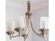 A modern silver chandelier with white glass shades at 11810 Imaginary Way, Orlando, FL 32832