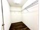 Walk-in closet with rod and wire shelving and hardwood flooring at 11810 Imaginary Way, Orlando, FL 32832
