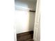 This closet features a wire shelf and dark wood-look flooring at 11810 Imaginary Way, Orlando, FL 32832