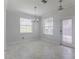 Light and airy dining room with tiled floors, chandelier, and lots of natural light at 11810 Imaginary Way, Orlando, FL 32832
