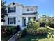 Charming two-story home featuring beautiful landscaping, a brick walkway and lovely curb appeal at 11810 Imaginary Way, Orlando, FL 32832