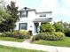 Charming two-story home with a meticulously landscaped front yard and inviting entryway at 11810 Imaginary Way, Orlando, FL 32832