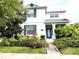 Charming two-story home with meticulously landscaped front yard and inviting entryway at 11810 Imaginary Way, Orlando, FL 32832