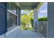 View from the front porch with blue shutters and decorative railings at 11810 Imaginary Way, Orlando, FL 32832
