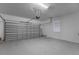 Spacious two-car garage with white walls, overhead door, and window at 11810 Imaginary Way, Orlando, FL 32832