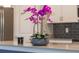 Modern kitchen featuring elegant granite countertops, stainless steel appliances, and a stylish backsplash at 11810 Imaginary Way, Orlando, FL 32832
