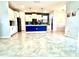Spacious kitchen with white cabinets, center island, and open layout with tile floors at 11810 Imaginary Way, Orlando, FL 32832