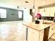 Open concept kitchen and living space with modern finishes and tile flooring throughout at 11810 Imaginary Way, Orlando, FL 32832
