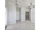 Open-plan living space with tile flooring and access to a patio at 11810 Imaginary Way, Orlando, FL 32832
