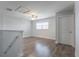 Laminate floor loft featuring a ceiling fan and natural light at 11810 Imaginary Way, Orlando, FL 32832
