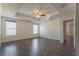Spacious main bedroom with tray ceiling, ceiling fan and hardwood floor at 11810 Imaginary Way, Orlando, FL 32832