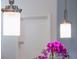 Stylish kitchen pendant lights complement the modern design and decor of the home at 11810 Imaginary Way, Orlando, FL 32832