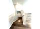The staircase has wood-look steps and white risers at 11810 Imaginary Way, Orlando, FL 32832