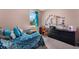 Bright bedroom featuring a desk and fun décor at 11980 Sands Cv, Orlando, FL 32828