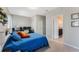 Bedroom features an ensuite bathroom and workspace at 11980 Sands Cv, Orlando, FL 32828
