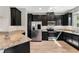 Kitchen boasts granite countertops, stainless steel appliances, and dark cabinetry at 11980 Sands Cv, Orlando, FL 32828