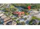 Aerial view of the community showcasing the pool, clubhouse, and surrounding neighborhood at 1205 Butterfly Orchid Rd, Davenport, FL 33837