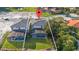 Aerial view of home showcasing a large backyard, screened pool, and community at 1205 Butterfly Orchid Rd, Davenport, FL 33837