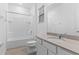 Bright bathroom with vanity, solid surface countertop, bath, and tile flooring at 1205 Butterfly Orchid Rd, Davenport, FL 33837