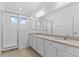 Modern bathroom with a glass-enclosed shower and double sink vanity with quartz countertop at 1205 Butterfly Orchid Rd, Davenport, FL 33837