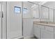 Bright bathroom features neutral tones, granite vanity, and a glass enclosed shower at 1205 Butterfly Orchid Rd, Davenport, FL 33837