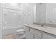 Clean, well-lit bathroom featuring a tub, shower and solid surface vanity at 1205 Butterfly Orchid Rd, Davenport, FL 33837