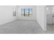 Spacious bedroom with plush carpeting, natural light, and access to a full bathroom at 1205 Butterfly Orchid Rd, Davenport, FL 33837