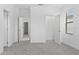Well-lit bedroom with plush carpeting and multiple entry ways to other rooms at 1205 Butterfly Orchid Rd, Davenport, FL 33837