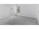Comfortable bedroom with plush carpeting with attached bathroom for convenience at 1205 Butterfly Orchid Rd, Davenport, FL 33837